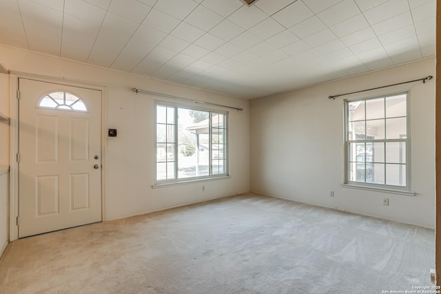 entryway featuring light carpet