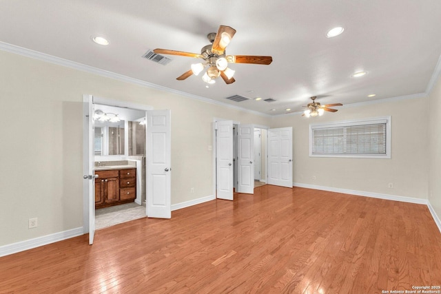 unfurnished bedroom featuring crown molding, ensuite bath, ceiling fan, and light wood-type flooring