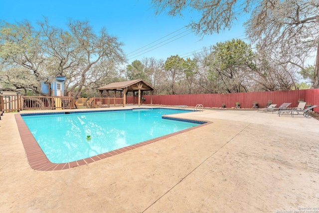 view of swimming pool with a gazebo and a patio