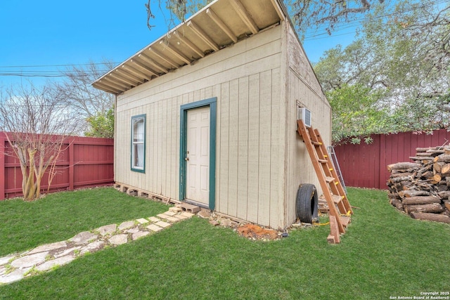 view of outbuilding featuring a lawn