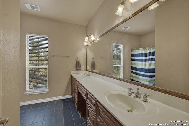 bathroom with tile patterned flooring, vanity, a healthy amount of sunlight, and a shower with curtain