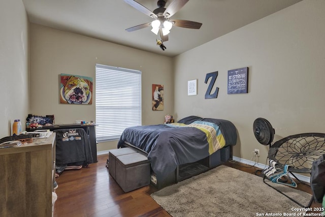 bedroom featuring dark wood-type flooring and ceiling fan