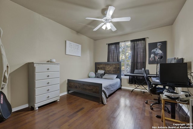 bedroom with ceiling fan and dark hardwood / wood-style flooring