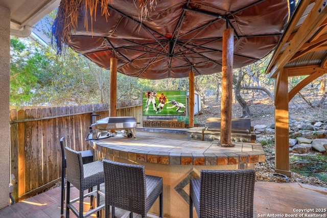 view of patio / terrace with a bar and grilling area