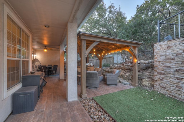 view of patio featuring an outdoor hangout area and ceiling fan