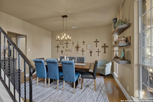 dining area featuring an inviting chandelier