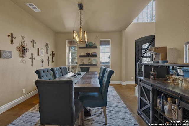 dining room with a chandelier and light wood-type flooring