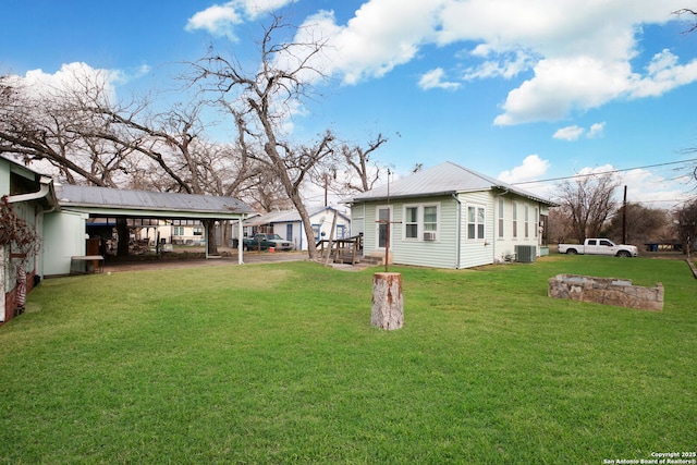 exterior space with a carport and central AC unit