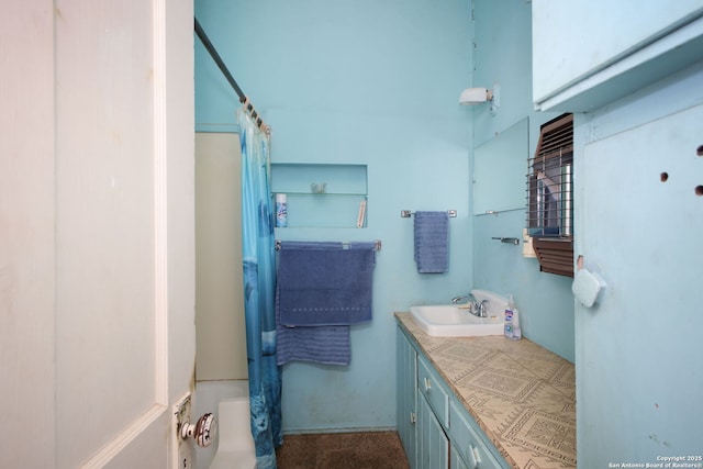 bathroom featuring vanity and shower / tub combo