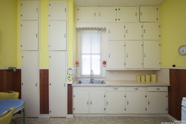 kitchen with white cabinetry and sink