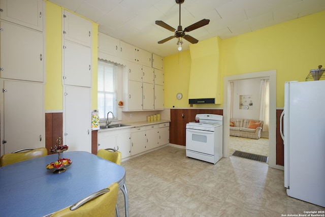 kitchen featuring ceiling fan, white appliances, sink, and white cabinets