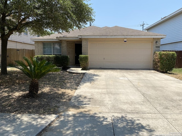 single story home featuring a garage