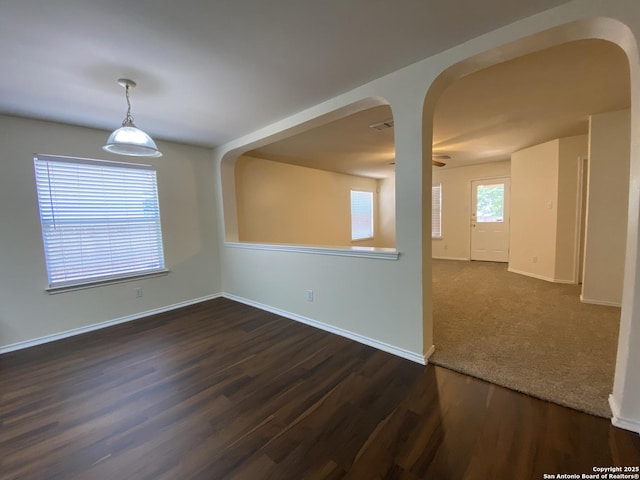 empty room featuring dark hardwood / wood-style flooring