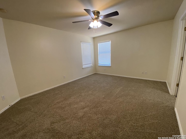 carpeted empty room featuring ceiling fan