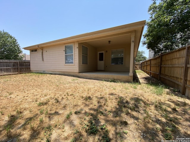 back of house with a patio area