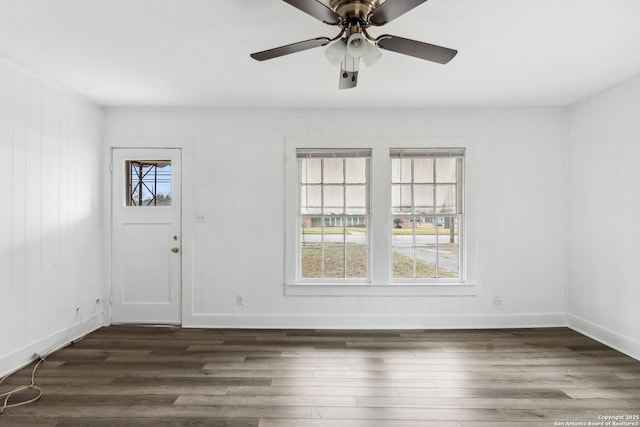 interior space with dark hardwood / wood-style floors and ceiling fan