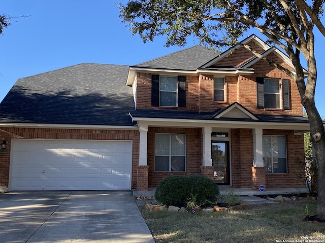 craftsman inspired home featuring a garage, driveway, and brick siding