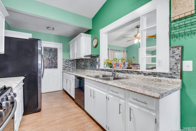 kitchen featuring sink, ceiling fan, stainless steel appliances, tasteful backsplash, and white cabinets