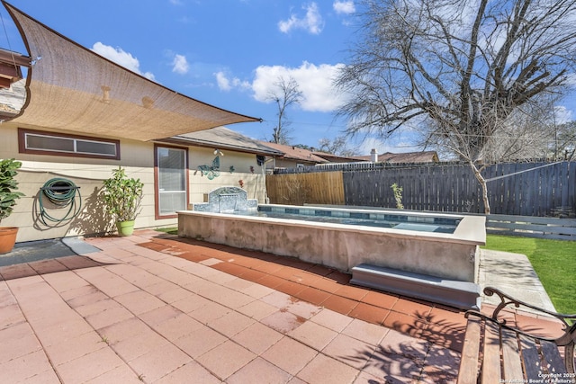 view of patio / terrace featuring a jacuzzi