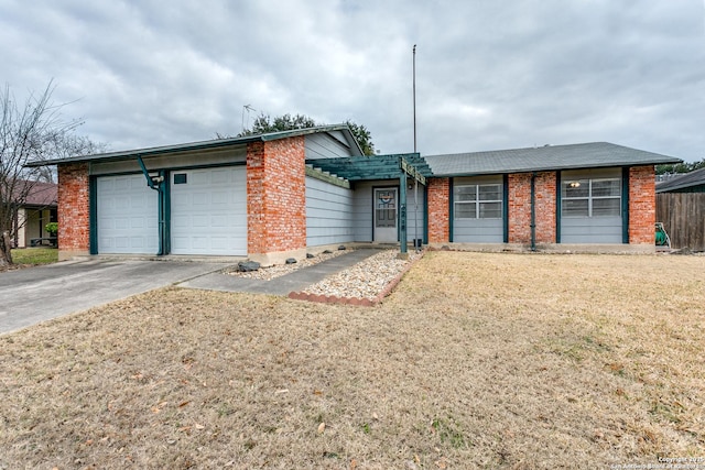 single story home featuring a garage and a front yard