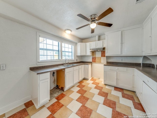 kitchen featuring white cabinetry, sink, a textured ceiling, and ceiling fan