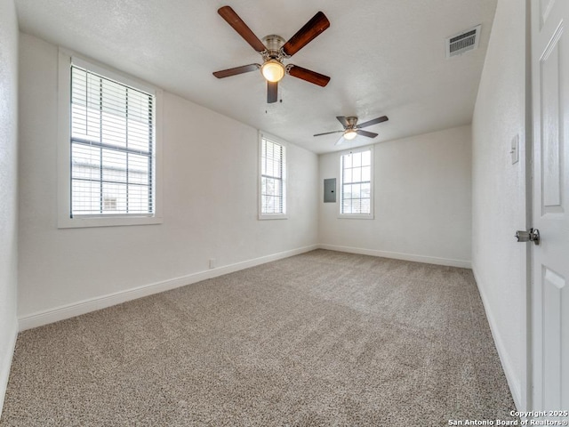 unfurnished room with carpet flooring and electric panel