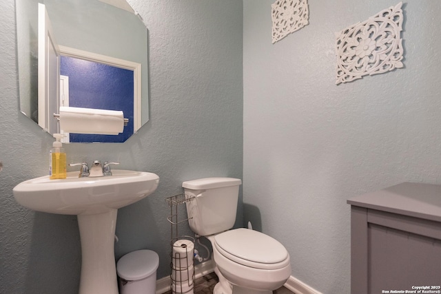 bathroom with sink and toilet