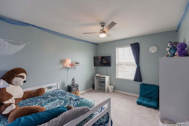 bedroom featuring light colored carpet and ceiling fan