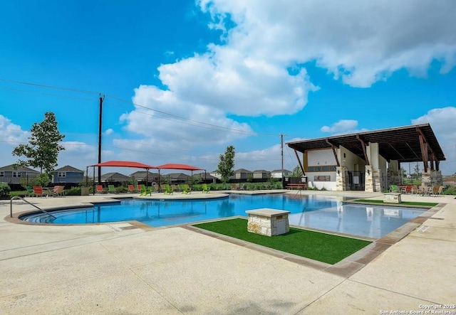 view of pool featuring a patio