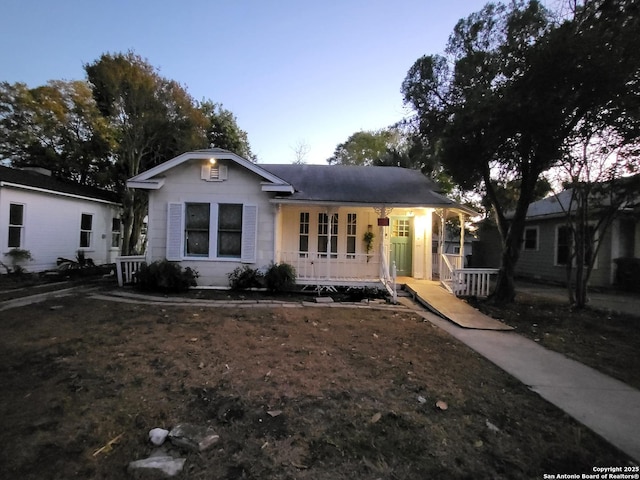 view of front of house featuring central AC unit and covered porch