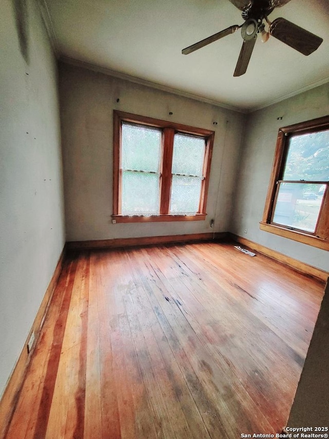 unfurnished room with ornamental molding, ceiling fan, and light hardwood / wood-style floors