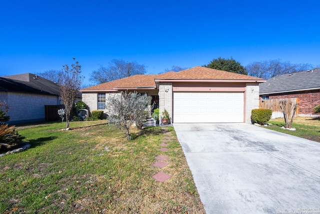 single story home with a garage and a front lawn