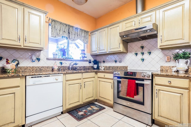 kitchen featuring light tile patterned floors, sink, dishwasher, stainless steel range with electric stovetop, and backsplash