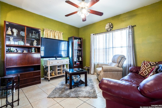 living room with light tile patterned flooring and ceiling fan