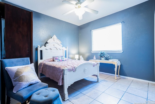 bedroom with light tile patterned flooring and ceiling fan