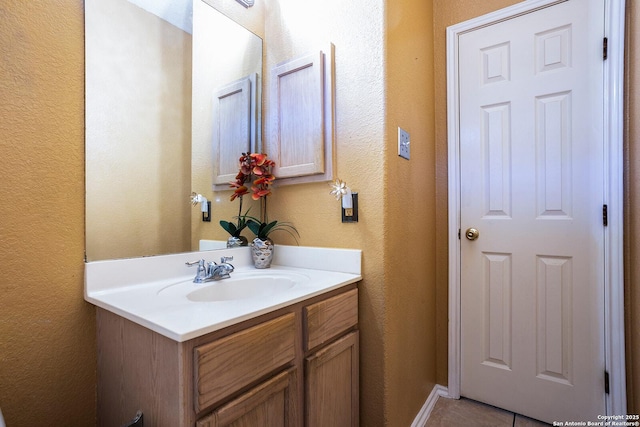 bathroom featuring tile patterned floors and vanity