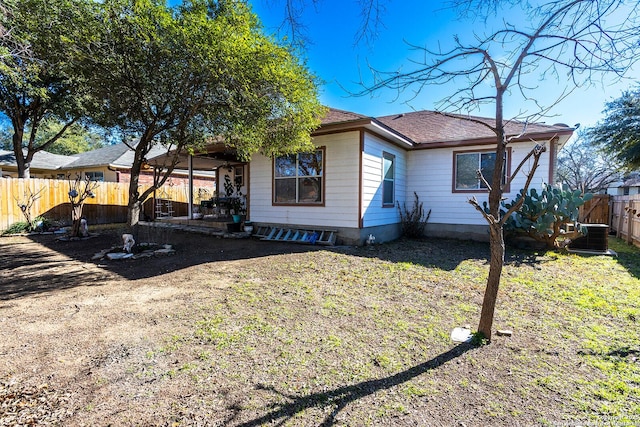 back of property with central AC unit