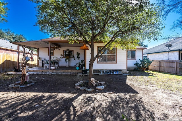 back of house featuring ceiling fan and a patio area