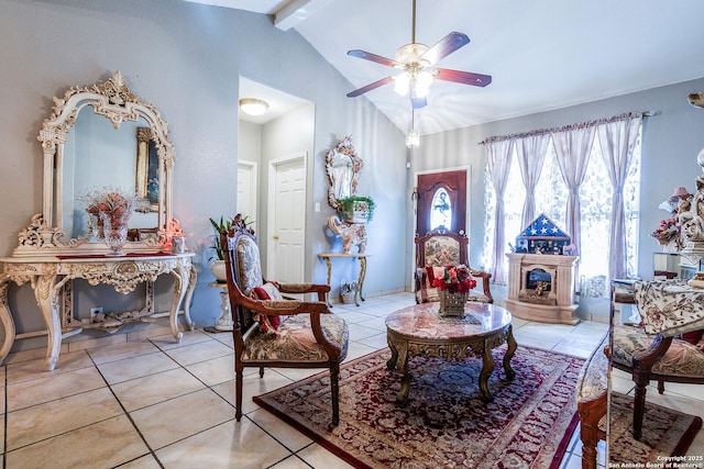 sitting room featuring ceiling fan, high vaulted ceiling, beamed ceiling, and light tile patterned flooring