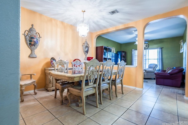 dining area with light tile patterned floors and ceiling fan