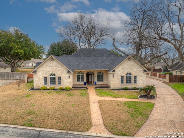 view of front facade with a front yard and a porch