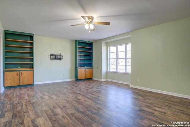 unfurnished living room featuring ceiling fan and dark hardwood / wood-style floors