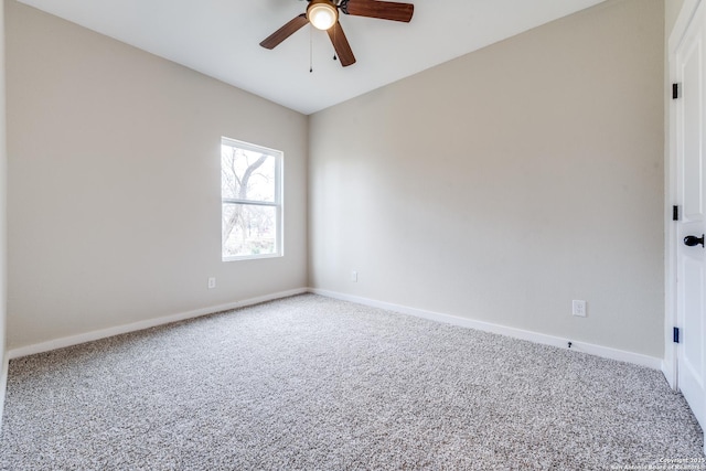 empty room featuring ceiling fan and carpet