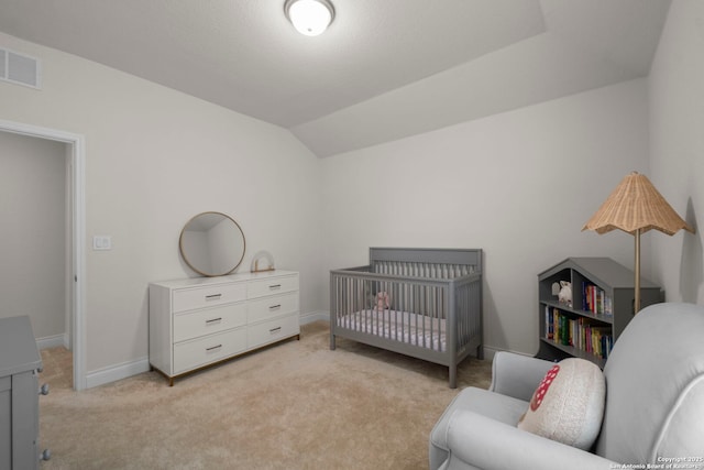 carpeted bedroom featuring lofted ceiling