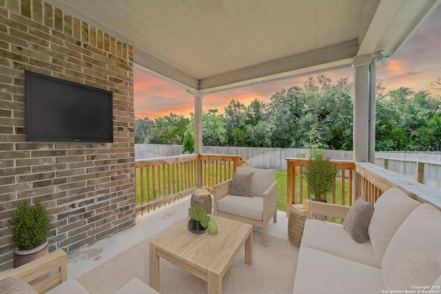 10732 Merrick Run, San Antonio, TX 78254 - patio terrace at dusk with outdoor lounge area and a fenced backyard