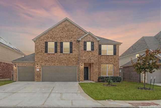 10732 Merrick Run, San Antonio, TX 78254 - traditional home with driveway, a yard, brick siding, and an attached garage