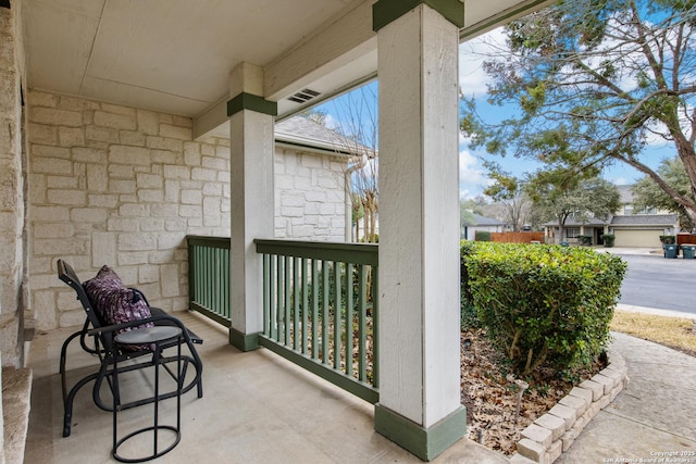 balcony featuring a porch