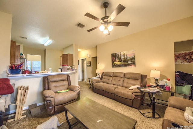 living room with light carpet and ceiling fan