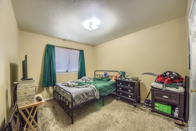 carpeted bedroom with a textured ceiling