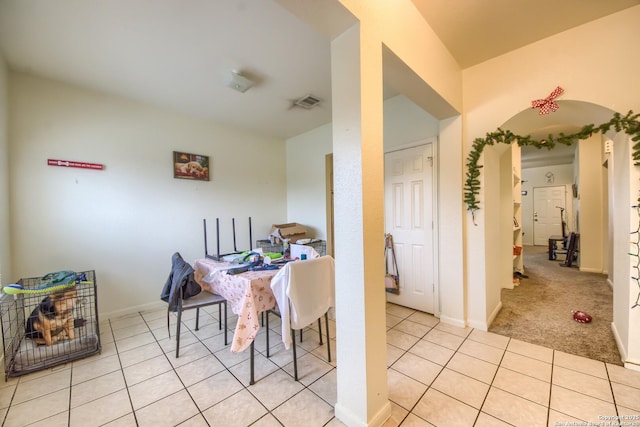 dining area with light tile patterned floors